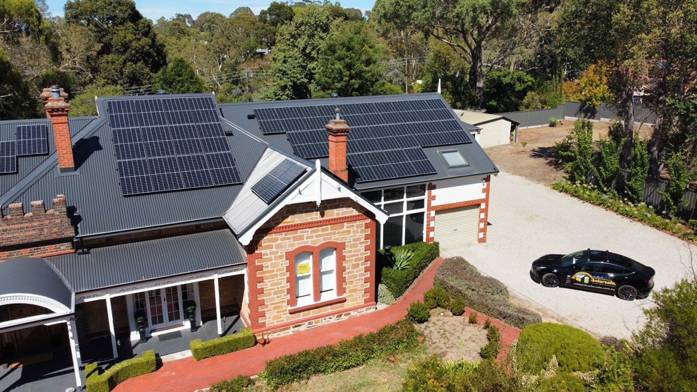 Aerial view of a residential rooftop solar array